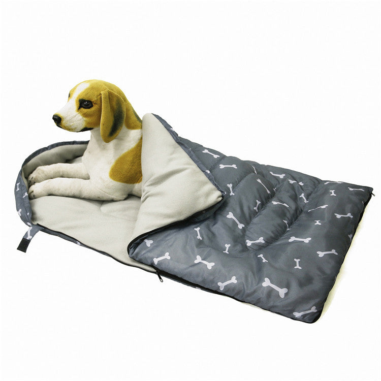 Bone-patterned dog sleep sack showcasing its spacious interior and soft padding.